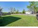 Spacious backyard featuring a large grassy area and a wooden privacy fence at 2880 Cavalcade Cir, Johns Island, SC 29455