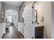 Hallway with a bathroom featuring modern fixtures and a dark wood vanity for a functional yet stylish space at 2880 Cavalcade Cir, Johns Island, SC 29455