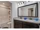 Bright bathroom featuring double sinks, granite countertops, and a shower/tub combo at 2880 Cavalcade Cir, Johns Island, SC 29455