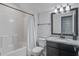Well-lit bathroom featuring a shower-tub combo and a vanity with granite countertop at 2880 Cavalcade Cir, Johns Island, SC 29455