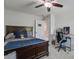 Bedroom with a large bed, ceiling fan, and a workspace with a desk and chair at 2880 Cavalcade Cir, Johns Island, SC 29455