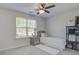 Bedroom featuring a cozy bed, nightstand, natural light, and shelving unit at 2880 Cavalcade Cir, Johns Island, SC 29455