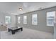 Open bonus room with lots of natural light and carpet floors at 2880 Cavalcade Cir, Johns Island, SC 29455