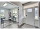 Sunlit foyer with hardwood floors, french doors, and natural light leading to a comfortable living space at 2880 Cavalcade Cir, Johns Island, SC 29455