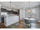 Eat in kitchen with sleek cabinetry, stainless steel appliances, and a charming dining area at 2880 Cavalcade Cir, Johns Island, SC 29455