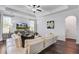 Bright living room showcasing recessed lighting, modern ceiling fan, white sofa, and stylish decor at 2880 Cavalcade Cir, Johns Island, SC 29455