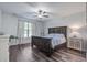 Serene bedroom featuring a ceiling fan, hardwood floors, and ample natural light at 2880 Cavalcade Cir, Johns Island, SC 29455