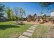Playground in backyard with climbing features, slides, swings, and picnic table at 2880 Cavalcade Cir, Johns Island, SC 29455