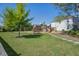 Backyard featuring a wooden playset, picnic table, and lush green lawn at 2880 Cavalcade Cir, Johns Island, SC 29455