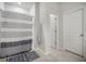 Bright bathroom featuring a walk-in shower with a gray and white striped curtain at 293 Firewheel Ct, Summerville, SC 29486