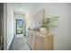 Bright foyer featuring hardwood floors, modern cabinet and decor, and bright natural light at 293 Firewheel Ct, Summerville, SC 29486