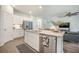 Kitchen island with dishwasher, stainless steel sink, granite counters, and open view to living room at 293 Firewheel Ct, Summerville, SC 29486