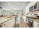 Modern kitchen with a granite countertop island, a stainless steel gas range, and an open floor plan at 293 Firewheel Ct, Summerville, SC 29486