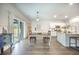 Bright kitchen and dining area with stainless appliances, granite counters and hardwood floors at 293 Firewheel Ct, Summerville, SC 29486