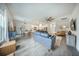Open concept living room leading into kitchen and dining area with modern decor and furnishings at 293 Firewheel Ct, Summerville, SC 29486