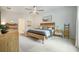 Bright bedroom featuring a ceiling fan, area rug, and minimalist decor at 293 Firewheel Ct, Summerville, SC 29486