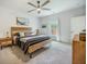 Bright bedroom features a ceiling fan, area rug, and minimalist decor at 293 Firewheel Ct, Summerville, SC 29486