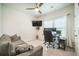 Modern office space with gray sofa, dual monitors, and comfortable rolling chair at 293 Firewheel Ct, Summerville, SC 29486