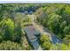 An aerial view highlighting the lush, green surroundings of a residence, nestled among trees and other homes in the area at 3001 Grand Bay Ln, Johns Island, SC 29455
