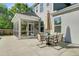 Backyard patio with outdoor dining area and screened porch leading to the house at 3001 Grand Bay Ln, Johns Island, SC 29455