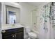 Bathroom with vanity and full tub/shower combo with decorative shower curtain at 3001 Grand Bay Ln, Johns Island, SC 29455