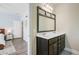 Well lit bathroom with a double sink vanity and a view into the home at 3001 Grand Bay Ln, Johns Island, SC 29455