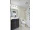 Clean bathroom featuring a dark vanity, a toilet, and a tub/shower combination at 3001 Grand Bay Ln, Johns Island, SC 29455