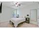 Comfortable bedroom featuring a ceiling fan, neutral walls, and bedside tables at 3001 Grand Bay Ln, Johns Island, SC 29455