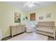 Charming Bedroom with a crib, dresser, rocker, hardwood floors, and a toucan print at 3001 Grand Bay Ln, Johns Island, SC 29455