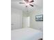 This light bedroom offers a ceiling fan, closet, and mounted tv at 3001 Grand Bay Ln, Johns Island, SC 29455