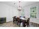 Dining room with stylish chandelier, wood table, and a wine cooler at 3001 Grand Bay Ln, Johns Island, SC 29455