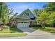 Charming two-story home with well-manicured lawn, attached garage, and inviting front porch at 3001 Grand Bay Ln, Johns Island, SC 29455
