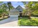 Charming two-story home with well-manicured lawn, attached garage, and inviting front porch at 3001 Grand Bay Ln, Johns Island, SC 29455