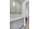 Gray kitchen cabinetry with quartz countertop space with a wine fridge on the side at 3001 Grand Bay Ln, Johns Island, SC 29455