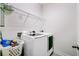 Functional laundry room with white machines, storage and a wire rack shelf at 3001 Grand Bay Ln, Johns Island, SC 29455