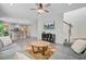 Open concept living room view with hardwood floors, with access to the kitchen and second-floor stairwell at 3001 Grand Bay Ln, Johns Island, SC 29455