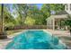 Inviting backyard pool with screened porch, mature trees, and plenty of space for relaxing and entertaining at 3001 Grand Bay Ln, Johns Island, SC 29455