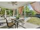 Relaxing screened porch with outdoor seating and views of the backyard pool at 3001 Grand Bay Ln, Johns Island, SC 29455