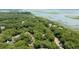 Expansive aerial view showing the property nestled among lush trees and scenic waterways at 3023 Maritime Forest Dr, Johns Island, SC 29455