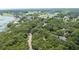 Scenic aerial view showcases the neighborhood near the golf course and waterfront at 3023 Maritime Forest Dr, Johns Island, SC 29455