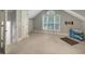 Bright bedroom featuring neutral walls, carpet, and a large window that lets in natural light at 3023 Maritime Forest Dr, Johns Island, SC 29455