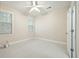 Neutral bedroom with white ceiling fan, carpet, and natural light from two windows at 3023 Maritime Forest Dr, Johns Island, SC 29455