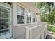 Exterior shot of deck with multiple windows overlooking the yard at 3023 Maritime Forest Dr, Johns Island, SC 29455