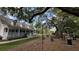 Charming exterior view with a wraparound porch, patio heaters, and a large yard, perfect for entertaining at 3023 Maritime Forest Dr, Johns Island, SC 29455