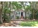 Inviting home with lush greenery, mature trees, and a classic brick stairway entrance at 3023 Maritime Forest Dr, Johns Island, SC 29455