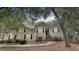 Charming two-story home featuring neutral siding, black shutters, and a brick stairway entrance at 3023 Maritime Forest Dr, Johns Island, SC 29455