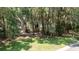 Charming home nestled among mature trees, featuring a classic brick stairway entrance at 3023 Maritime Forest Dr, Johns Island, SC 29455