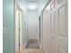 Hallway with tile floor, multiple doors, and lots of storage at 3023 Maritime Forest Dr, Johns Island, SC 29455