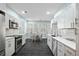 Modern kitchen with white cabinets, stainless steel appliances, and eat-in breakfast nook at 3023 Maritime Forest Dr, Johns Island, SC 29455
