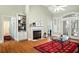 Bright living area boasts a marble fireplace, built-in shelving, and light-filled windows at 3023 Maritime Forest Dr, Johns Island, SC 29455